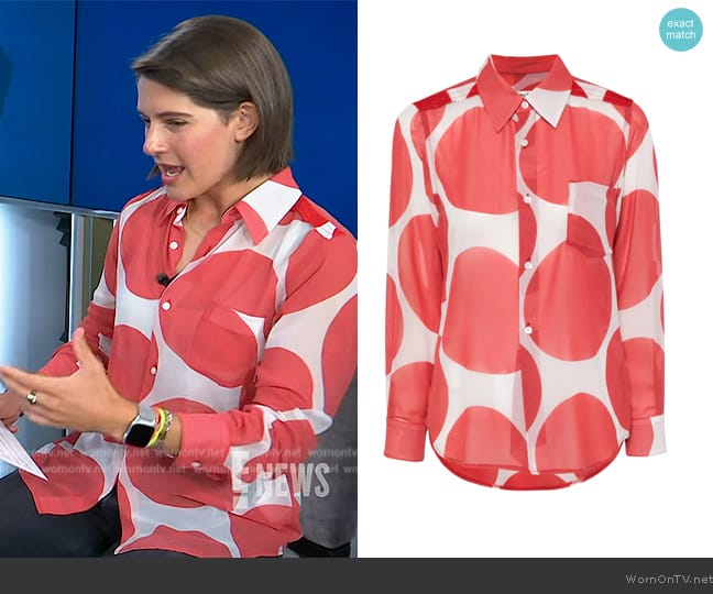 Comme Des Gargons Bold polka dot- print shirt worn by Daryn Carp on E! News