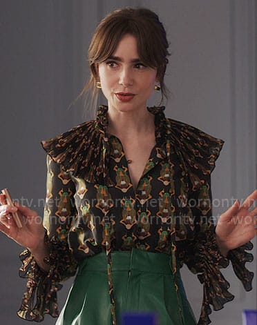 Emily's beetle print blouse and green leather shorts on Emily in Paris