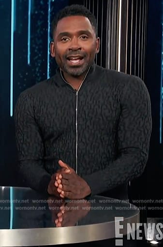 Justin’s black textured zip cardigan on E! News