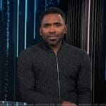 Justin’s black textured zip cardigan on E! News