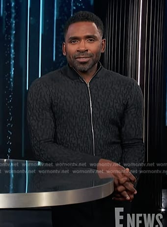 Justin’s black textured zip cardigan on E! News