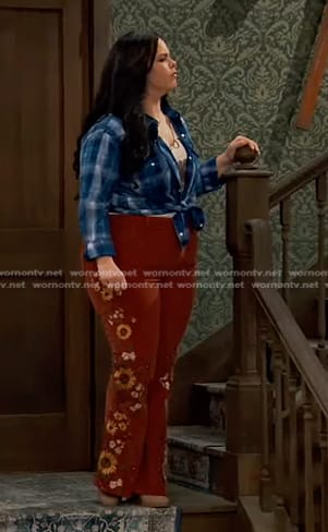 Lou’s blue plaid shirt and brown sunflower flare pants on Bunkd