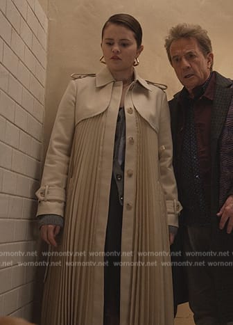 Mabel’s pleated trench coat and cardigan on Only Murders in the Building