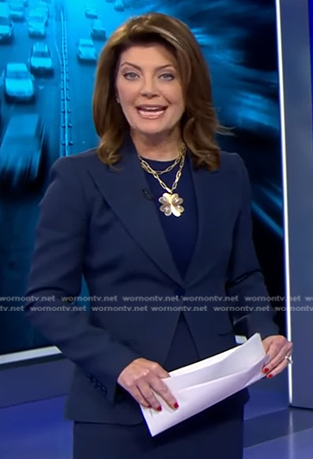 Norah's navy peak lapel blazer on CBS Evening News