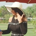 Sara’s black off-shoulder logo dress on The Real Housewives of Dubai