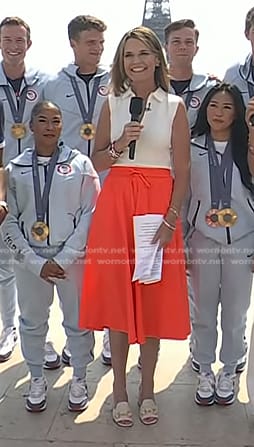 Savannah's white zip front top and orange skirt on Today