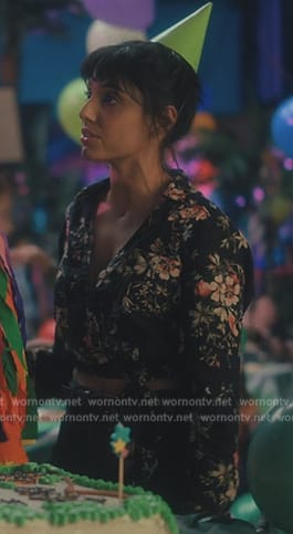 Lila's black floral print wrap blouse on The Umbrella Academy