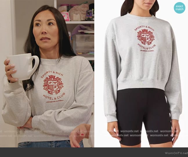 Sporty & Rich Hotel Flocked Logo Cropped Sweatshirt in Cotton worn by Katie Ginella on The Real Housewives of Orange County