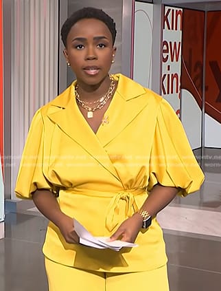 Zinhle’s yellow puff sleeve wrap blouse on NBC News Daily