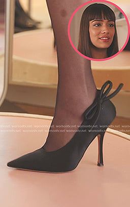 Genevieve’s black bow pumps on Emily in Paris