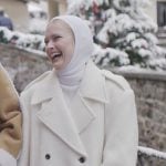 Camille’s white double breasted coat on Emily in Paris