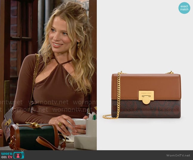 Charles & Keith Snake Print Chain-Strap Bag in Chocolate worn by Summer Newman (Allison Lanier) on The Young and the Restless