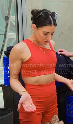 Chloe's red asymmetric sports bra and bike shorts set on Owning Manhattan