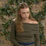 Claire’s green knit off-shoulder top and plaid skirt on The Young and the Restless