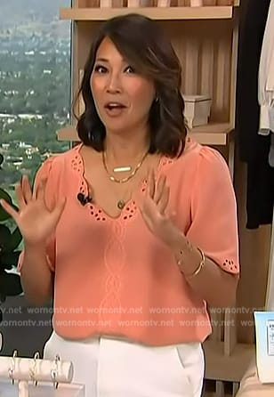 Diane's orange eyelet top on Access Hollywood