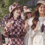 Emily’s pink check trench coat and top on Emily in Paris