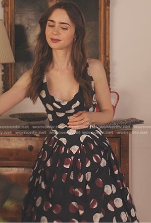 Emily’s black polka dot dress on Emily in Paris