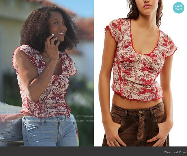 Jax’s floral print ruffle trim top on Reasonable Doubt