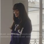 Genevieve’s purple NYU purple graphic hoodie on Emily in Paris