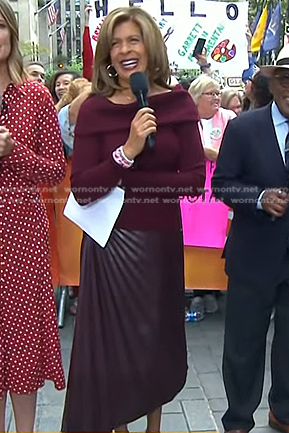 Hoda's burgundy off-shoulder sweater and pleated leather midi skirt on Today