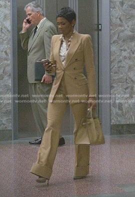 Jax's floral blouse and beige suit on Reasonable Doubt