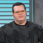 Josh Gad’s black printed sweater on Access Hollywood