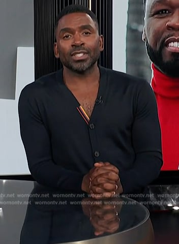 Justin's black cardigan on E! News