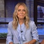Kelly’s blue tie neck blouse on Live with Kelly and Mark
