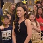 Lacey Chabert’s black long dress with contrast trim on Celebrations with Lacey Chabert