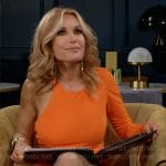 Lauren’s orange one-sleeve dress on The Young and the Restless