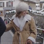 Louis’s suede shearling coat and brown leather bag on Emily in Paris