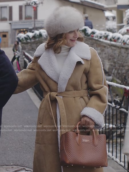 Louis's suede shearling coat and brown leather bag on Emily in Paris