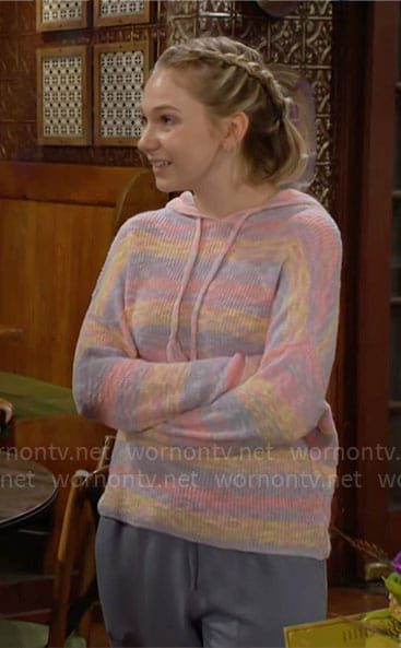 Lucy's pastel striped knit hoodie on The Young and the Restless