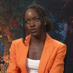 Lupita Nyong’o’s orange double breasted blazer on E! News