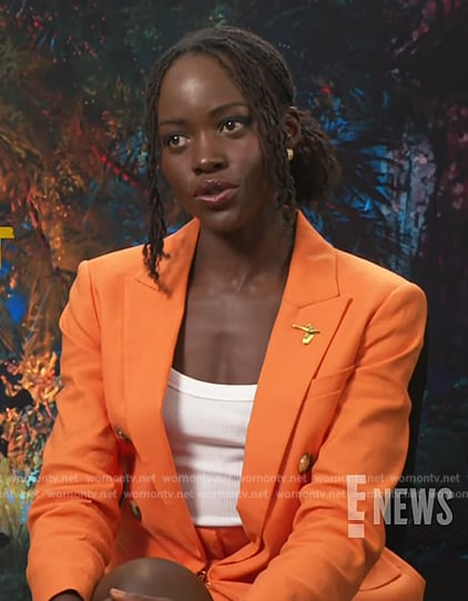 Lupita Nyong’o’s orange double breasted blazer on E! News