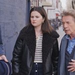 Mabel’s striped knit sweater and leather jacket on Only Murders in the Building