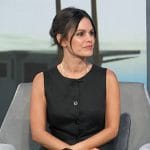 Rachel Bilson’s black vest and mini skirt on Access Hollywood