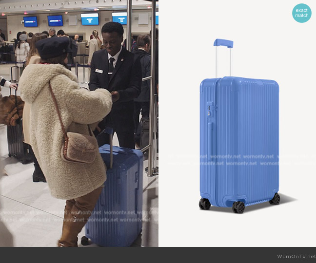 Rimowa Check-In L Essential Suitcase worn by Emily Cooper (Lily Collins) on Emily in Paris