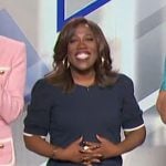 Sheryl’s navy top with white trim on The Talk