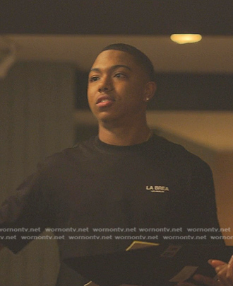 Spenser's black logo tee on Reasonable Doubt