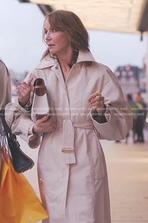 Sylvie's beige belted coat on Emily in Paris