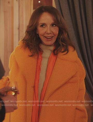 Sylvie's orange fur coat on Emily in Paris