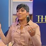 Tamron’s brown suede fringe shirt on Tamron Hall Show