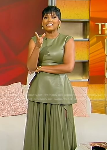 Tamron's green leather top and pleated skirt on Tamron Hall Show