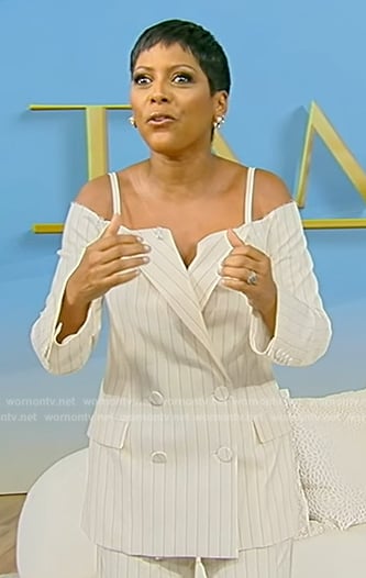 Tamron's white pinstripe cold shoulder blazer on Tamron Hall Show