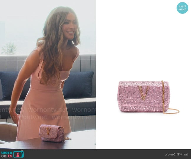 Versace Virtus rhinestone-embellished shoulder bag worn by Chrishell Stause on Selling Sunset