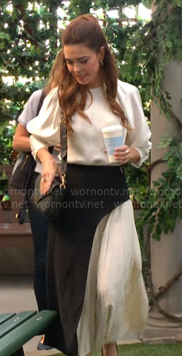 Victoria's white blouse and black and white pleated skirt on The Young and the Restless