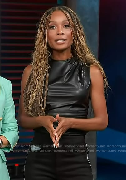 Zuri's black leather top and jeans on Access Hollywood