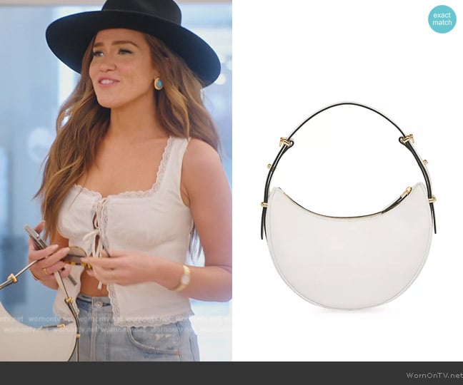 Brynn’s white leather round bag on RHONY