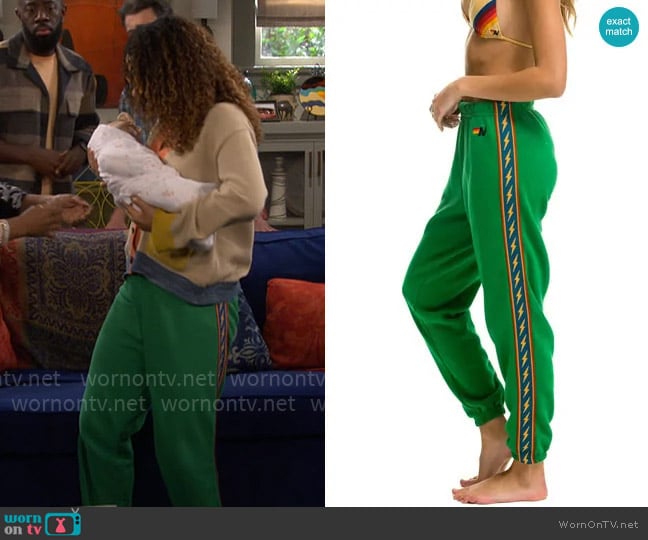 Aviator Nation Bolt Stripe Sweatpants in Kelly Green worn by Courtney (Skye Townsend) on The Neighborhood